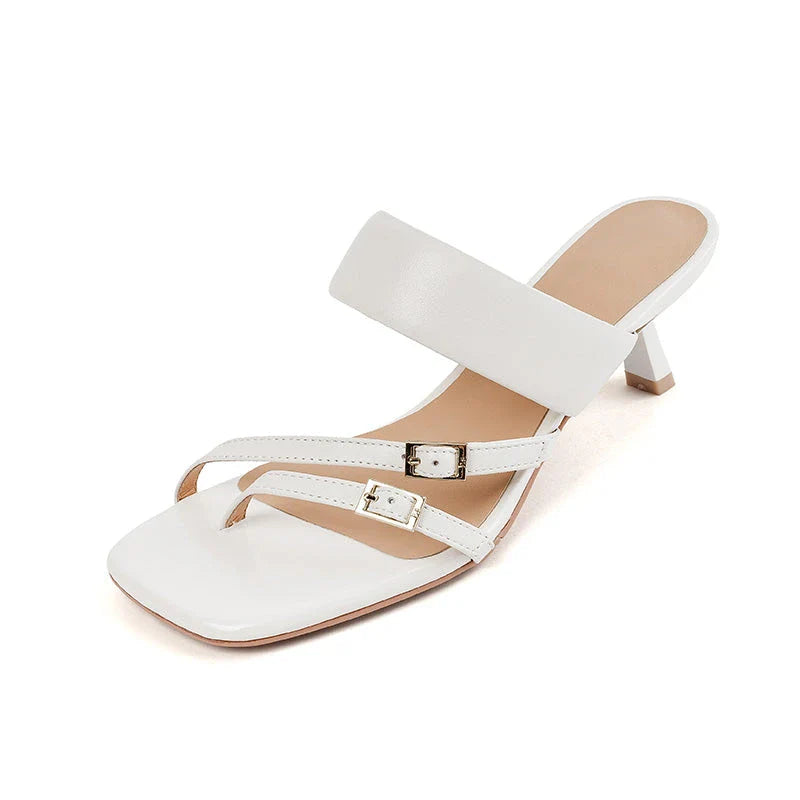 Elegant black genuine leather high heel open toe sandals with a sleek silhouette and chic buckle detail