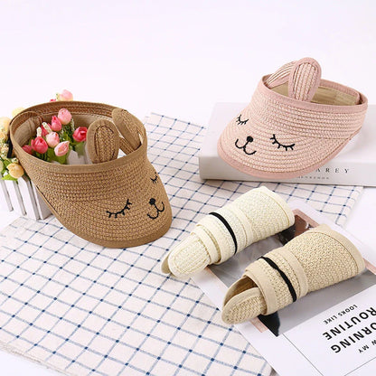 Rabbit-themed straw sun hat for kids with adjustable strap and foldable design for portability
