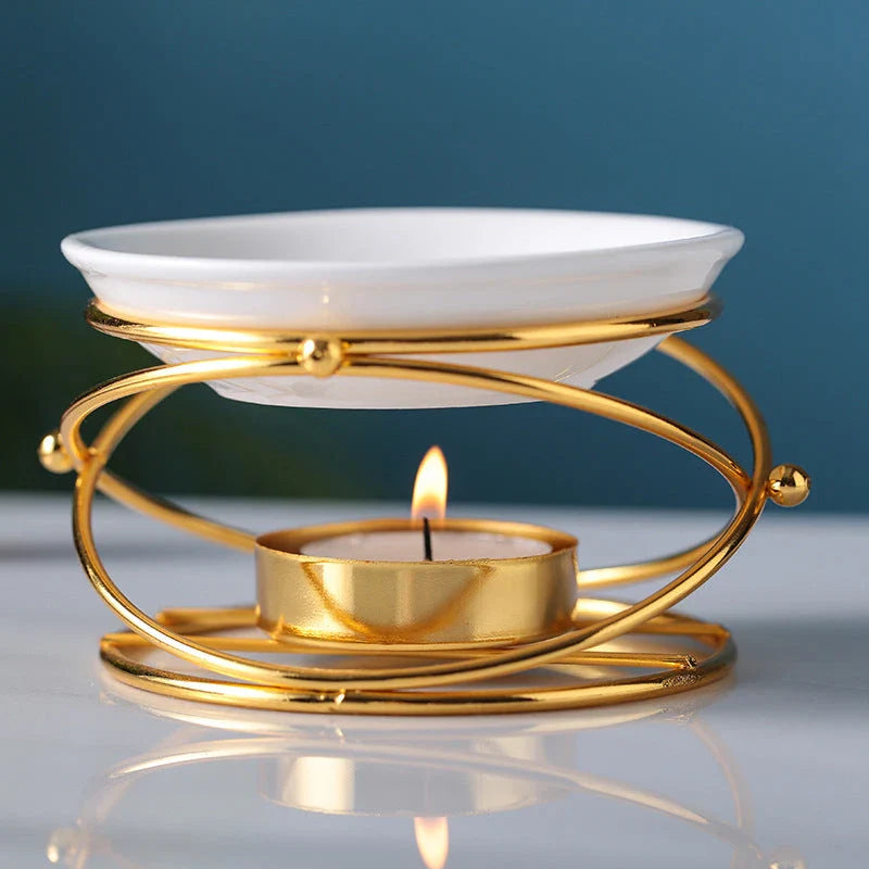 Elegant gold aromatherapy oil burner with a unique hollow-out design, creating a soothing and sophisticated ambiance in a living space