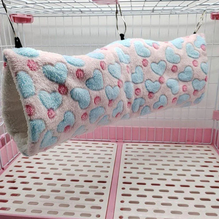 Cosy plush tunnel in grey for small pets like hamsters and guinea pigs, providing a comfortable and secure hideaway