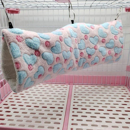 Cosy plush tunnel in grey for small pets like hamsters and guinea pigs, providing a comfortable and secure hideaway