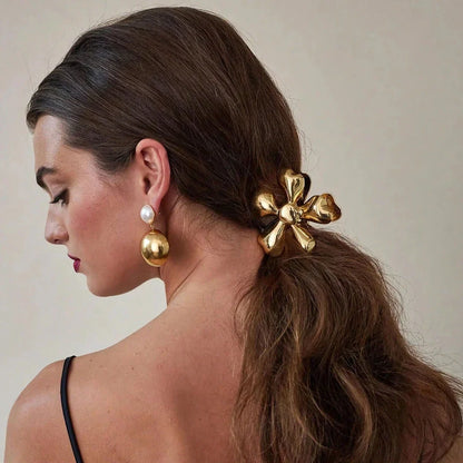 Gold floral metal hair claws - chic hair accessories for women with modern design and natural elegance