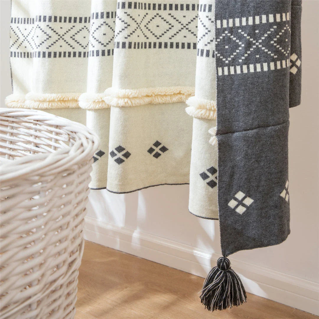 Cosy cotton tufted throw blanket with a geometric pattern and tassels in a soft yellow colour