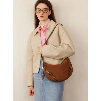 Elegant leather shoulder and crossbody bag for women, featuring a spacious main compartment, interior zip pocket, and contemporary design