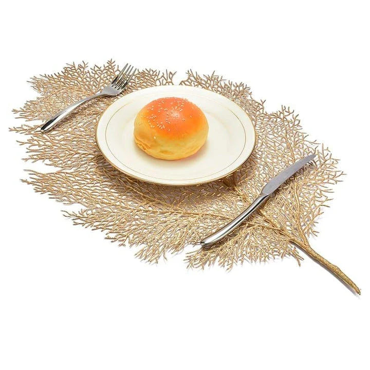 Elegant floral-patterned PVC dining table coaster in a contemporary setting, protecting a wooden table surface