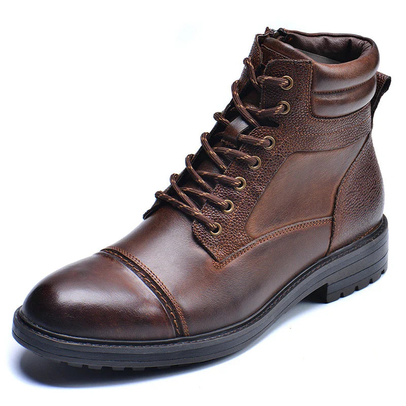 A pair of durable, stylish cowhide leather men's boots in a classic British design