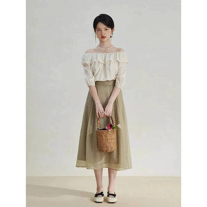 Elegant high-waist a-line midi skirt in a solid, vibrant colour for professional and social wear