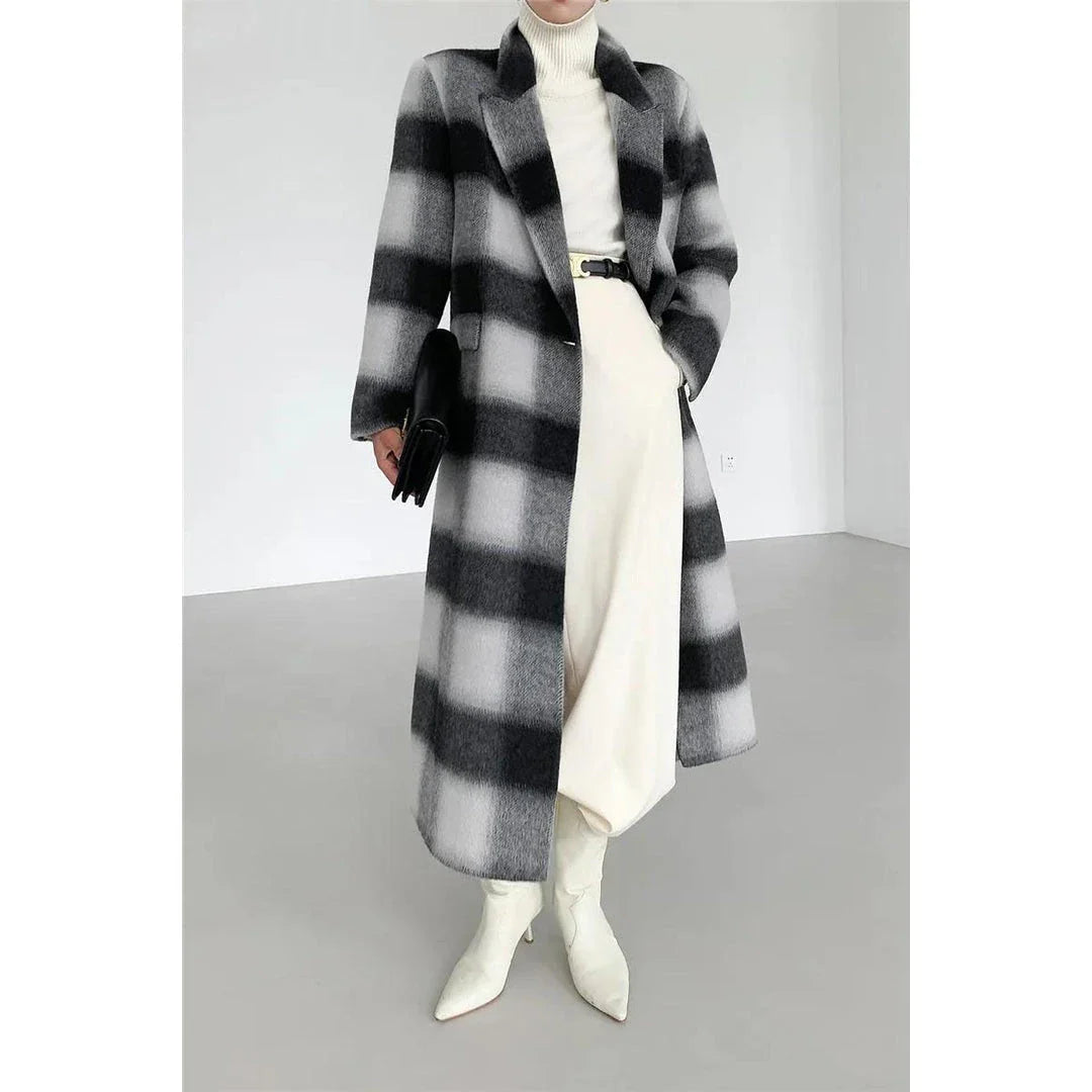 Elegant plaid double-breasted long woollen coat for women, featuring a premium blend of wool, cotton and polyester for exceptional quality and warmth.