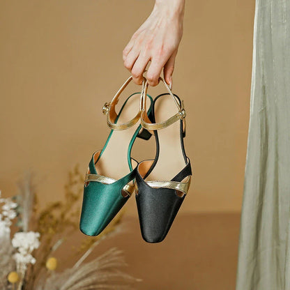 Elegant green high heel sandals with ankle strap, showcasing a sophisticated square heel design and premium materials
