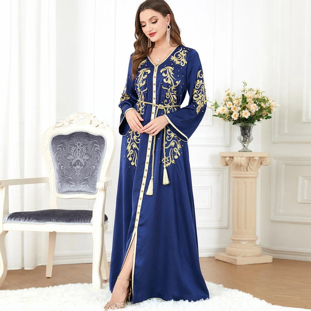 A sophisticated long-sleeve women's dress with a captivating floral embroidery pattern and a refined colour palette, suitable for a variety of occasions.