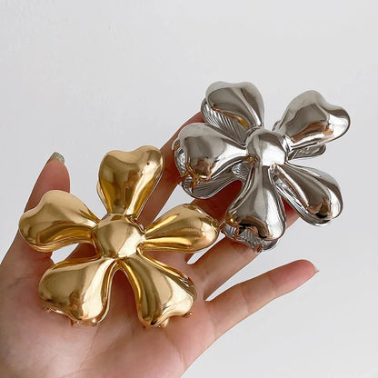Gold floral metal hair claws - chic hair accessories for women with modern design and natural elegance
