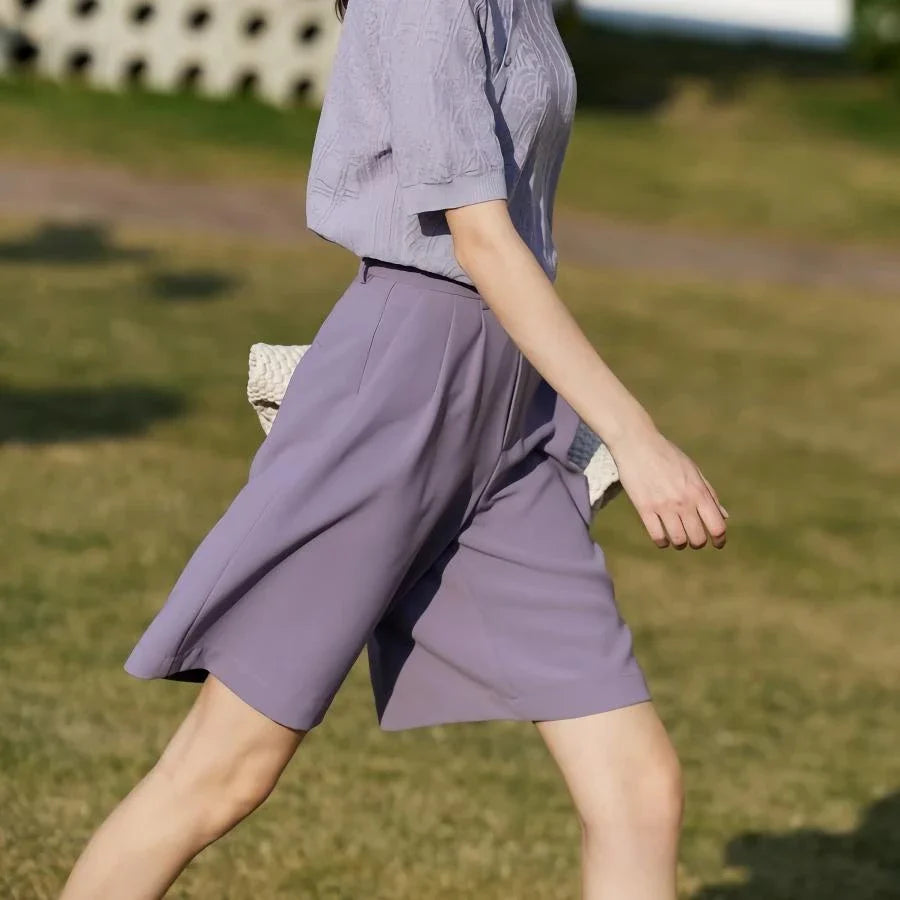 Elegant wide-leg shirred shorts in deep blue, designed for the modern British woman