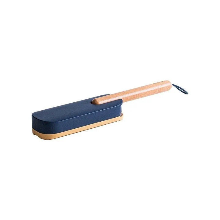 Premium pet hair removal brush with grey handle and bristles, designed for use in UK homes