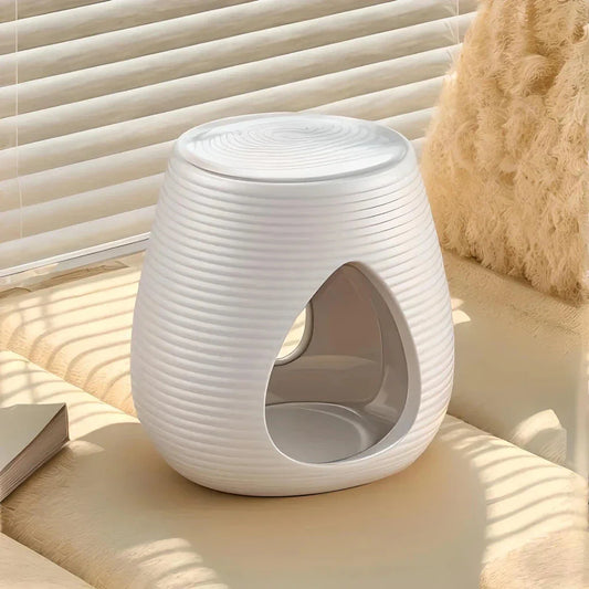 Elegant porcelain aroma diffuser and candle holder in white and black, featuring a minimalist design and compact size for versatile home decor.