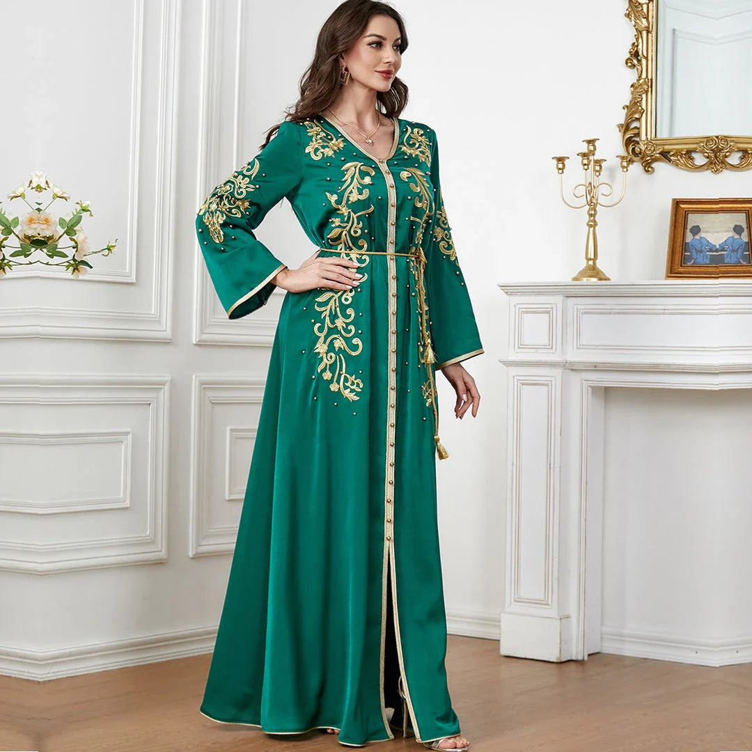 A sophisticated long-sleeve women's dress with a captivating floral embroidery pattern and a refined colour palette, suitable for a variety of occasions.