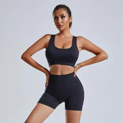 Premium seamless yoga set with women's vest and high-waisted shorts in classic black colour