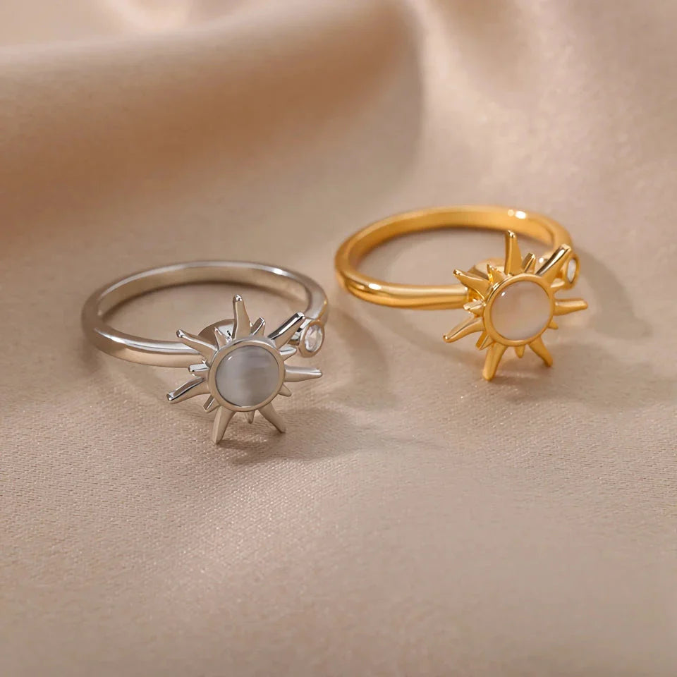 Adjustable stainless steel ring with rotating sun opal centerpiece, offering a modern and sophisticated geometric design for fashionable women