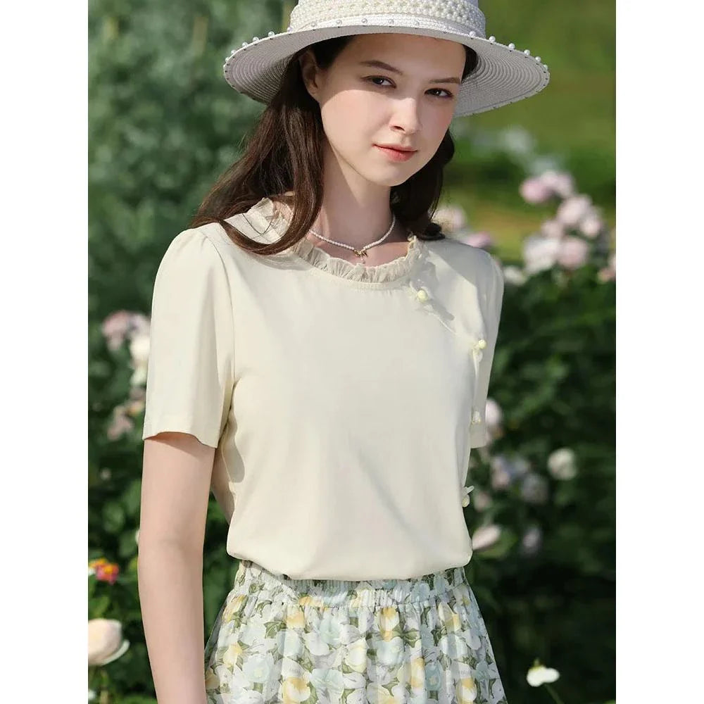 Elegant floral short sleeve t-shirt with wooden ear side detail, perfect for chic British summer style