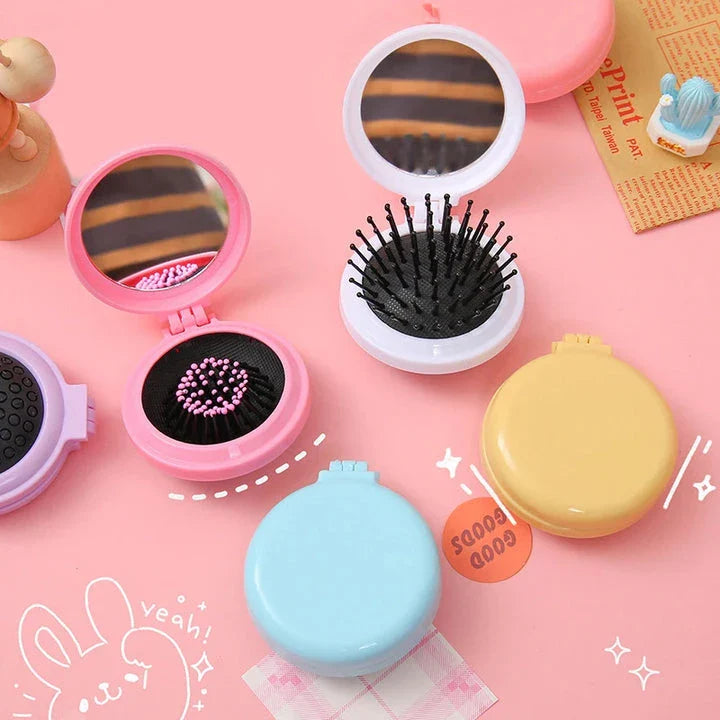 Portable folding hair comb with mirror, featuring a dual-sided design with a round mirror and eco-friendly hairbrush for on-the-go styling and grooming