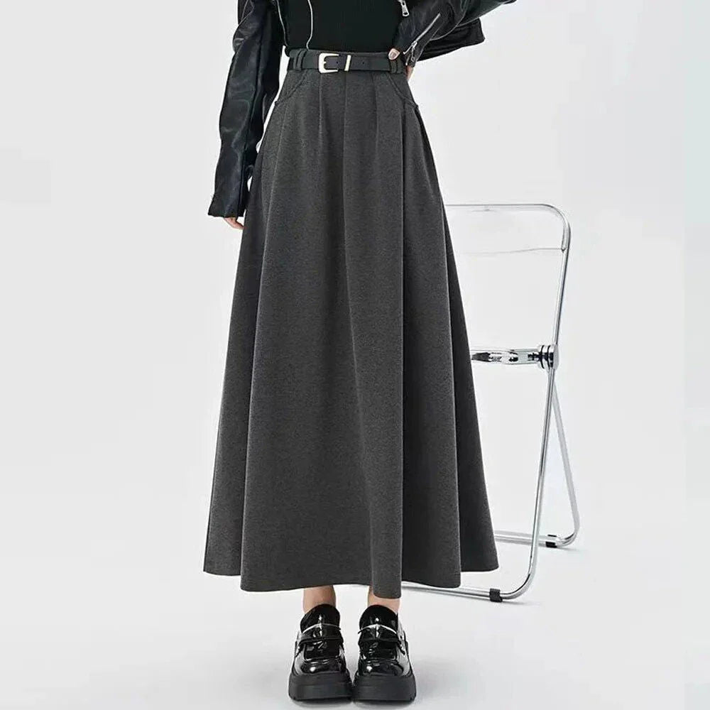 Elegant high-waisted pleated maxi skirt for stylish British women, featuring a classic A-line silhouette and solid colour design