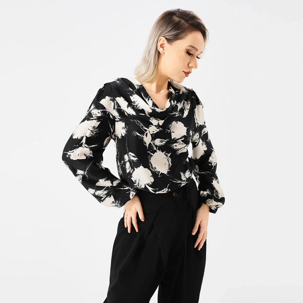 Elegant ladies' blouse with a printed pattern, dropped collar, and long sleeves in a classic white colour