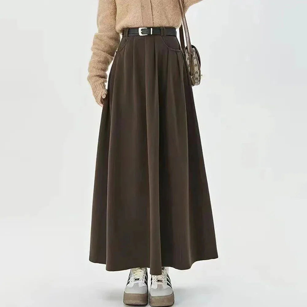 Elegant high-waisted pleated maxi skirt for stylish British women, featuring a classic A-line silhouette and solid colour design