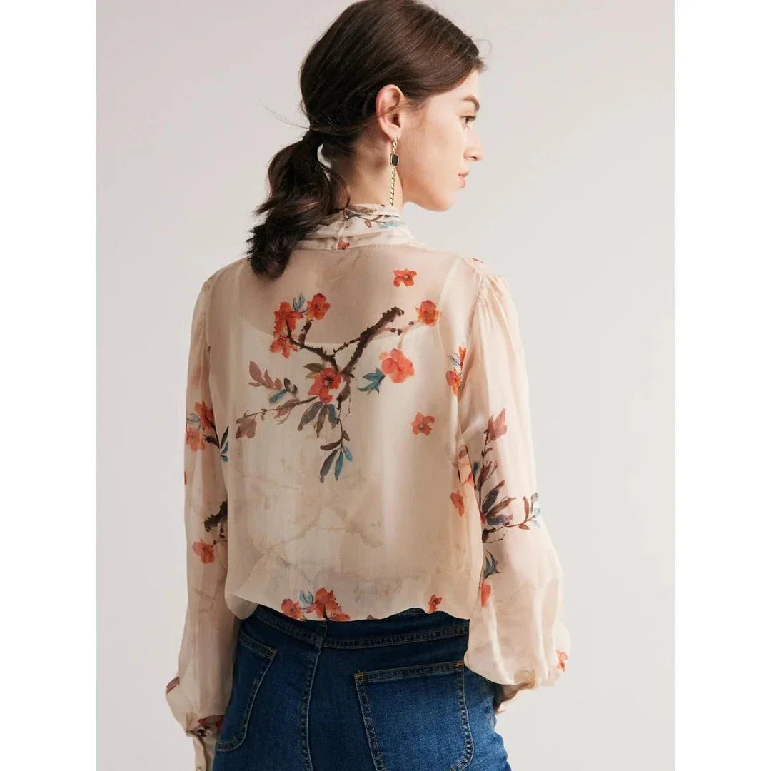 Elegant floral pattern silk and viscose blend blouse with bow collar and puff sleeves