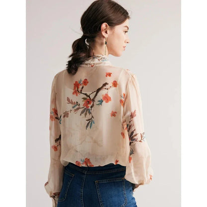 Elegant floral pattern silk and viscose blend blouse with bow collar and puff sleeves