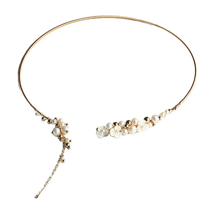 Elegant handcrafted clavicle necklace made of natural pearl shell with an intricate floral pattern, a timeless British design accessory.