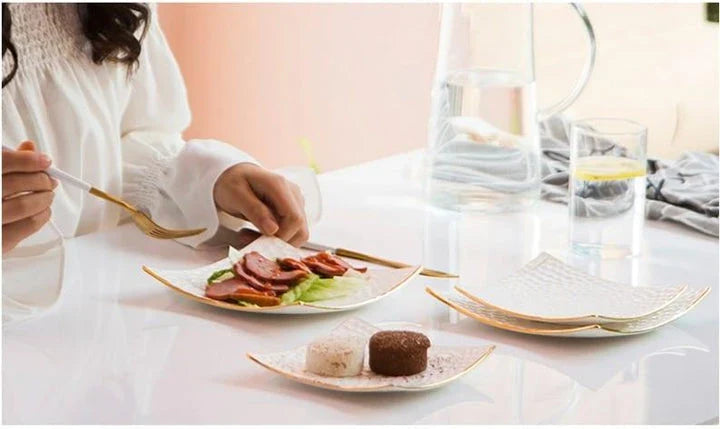 Elegant embossed ceramic cake plate in white color, perfect for serving cakes and pastries during afternoon tea