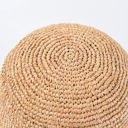 Handcrafted raffia sun hat for women, with a flat brim design and adjustable sizing for versatile sun protection and stylish summer wear