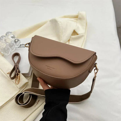 A stylish pillow-shaped shoulder bag made of high-quality PU leather, featuring a crossbody and messenger design for versatile use.