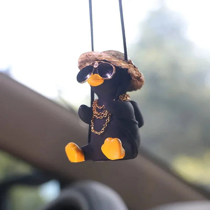 Charming swinging duck car accessory with guitar and coke-themed design, offering a unique and personalized driving experience