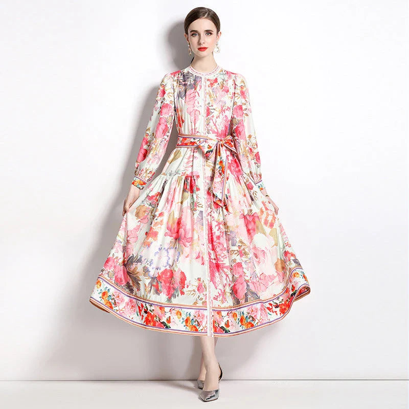 Elegant floral single-breasted swing dress with delicate print, tailored design, and flowing silhouette