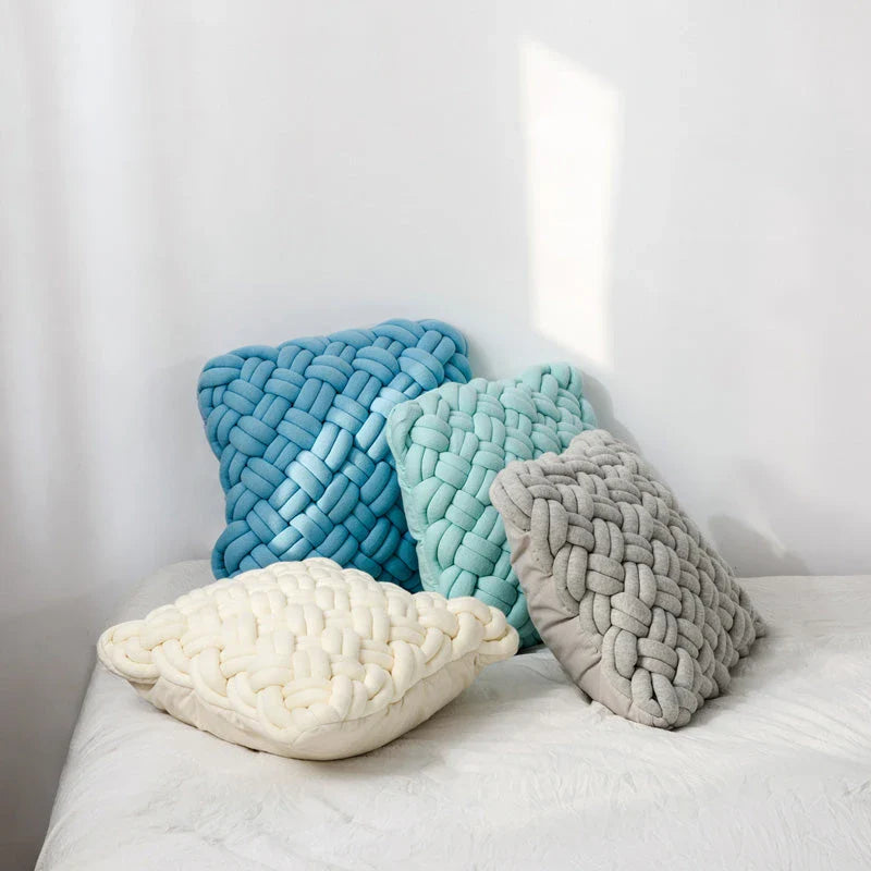 Handmade cotton throw pillow with unique knotted design in a sky blue colour