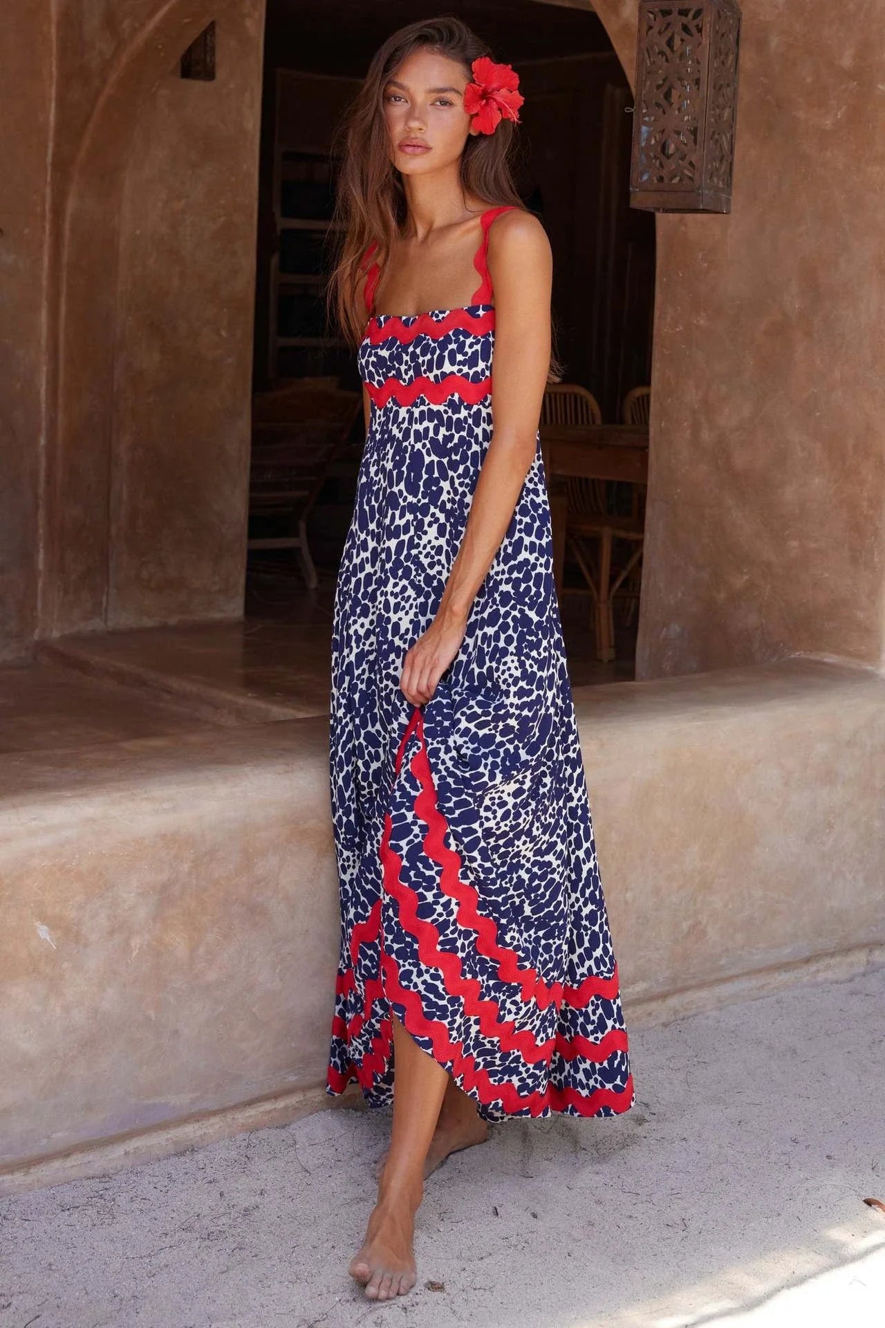 Elegant floral print suspender midi dress in black, perfect for summer beach holidays in the UK