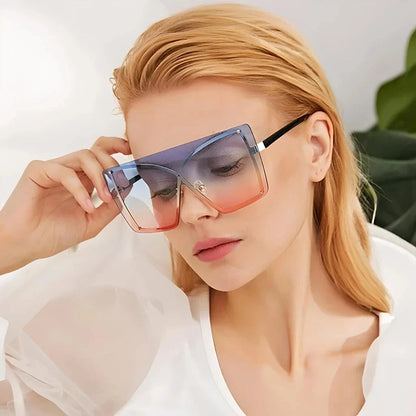 Stylish oversized flat top sunglasses with a rimless design, providing UV protection and a comfortable fit for the modern British woman