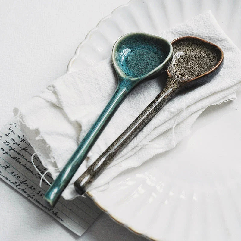 Elegant British ceramic soup spoon with long handle and vibrant glaze for refined dining experience