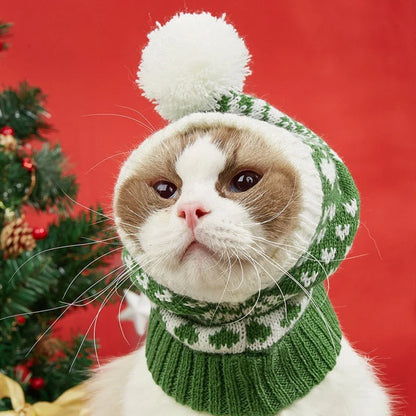 A cosy, knitted pet hat in a festive snowflake and reindeer design, available in various sizes to fit dogs and cats.
