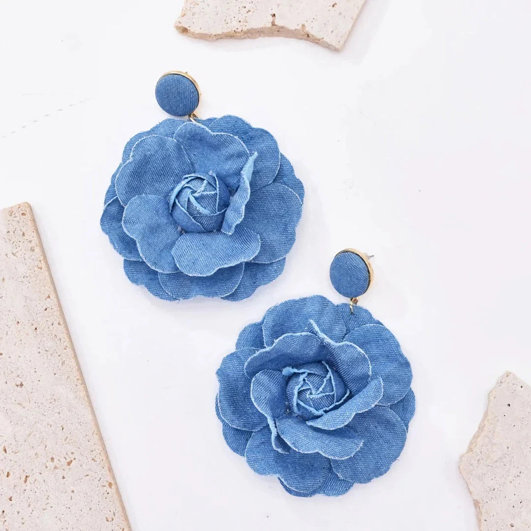 Elegant denim drop earrings with intricate details, a versatile accessory that adds a touch of refined British style to any outfit.