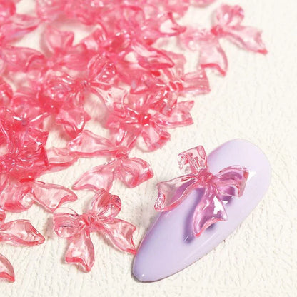 Charming candy-coloured bow nail charms in various colours, perfect for adding a playful touch to your manicure