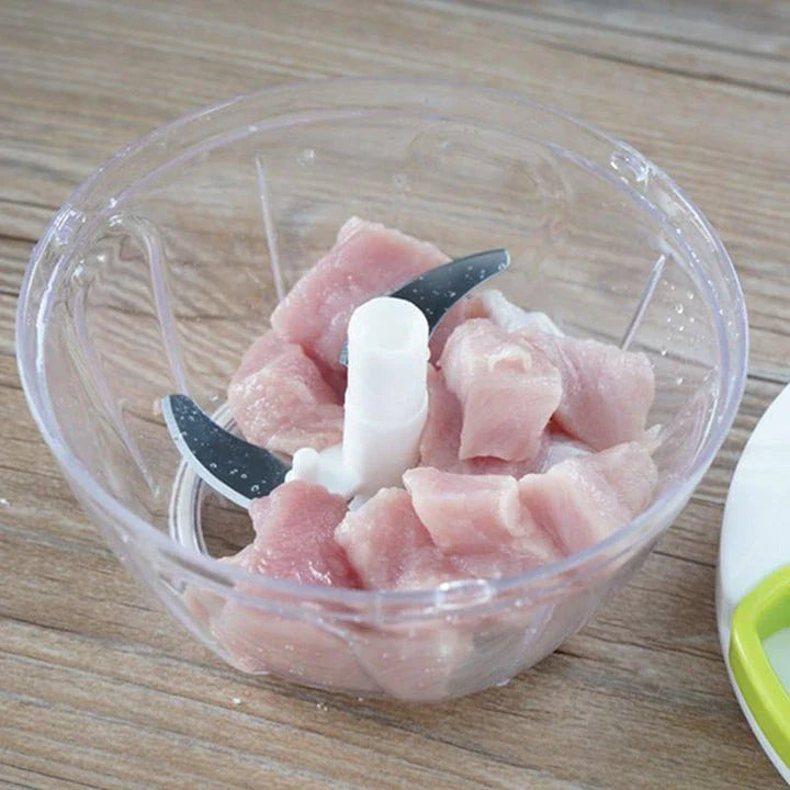 Portable Hand Pull Food Chopper with light green body and 3 sharp blades for easy chopping, slicing, and dicing in UK kitchens