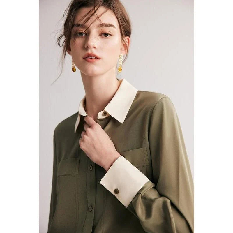 A chic and elegant silk crepe de chine blouse in a timeless solid pattern, perfect for professional and casual wear.