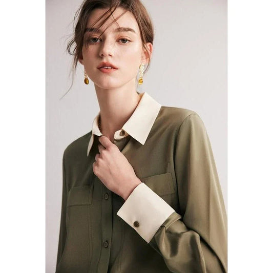 A chic and elegant silk crepe de chine blouse in a timeless solid pattern, perfect for professional and casual wear.