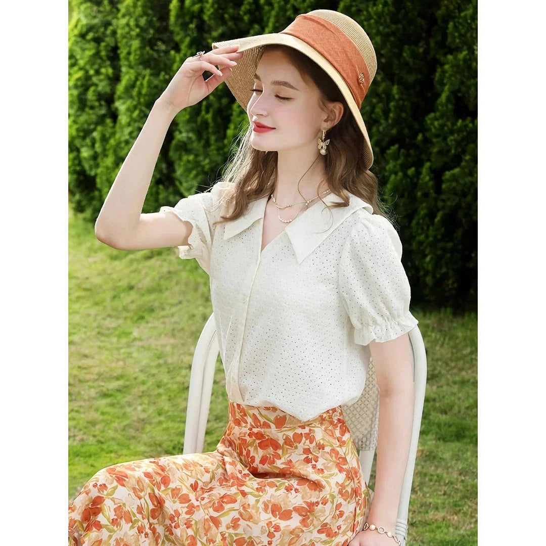 Elegant apricot French-inspired lace blouse with puff sleeves and v-neck collar, perfect for the modern British woman
