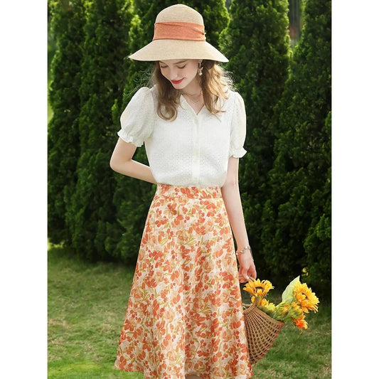 Elegant apricot French-inspired lace blouse with puff sleeves and v-neck collar, perfect for the modern British woman