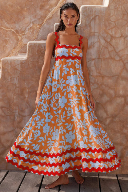 Elegant floral print suspender midi dress in black, perfect for summer beach holidays in the UK