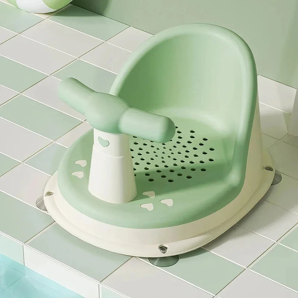 Cosy infant bath tub with large suction cups and ergonomic curved design for safe and comfortable bathing