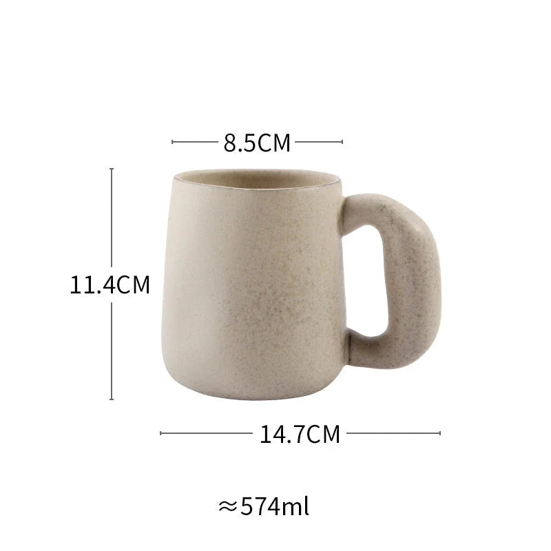 Elegant Japanese stoneware retro coffee mug in solid apricot and grey colours with comfortable handgrip shape