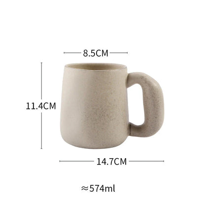 Elegant Japanese stoneware retro coffee mug in solid apricot and grey colours with comfortable handgrip shape